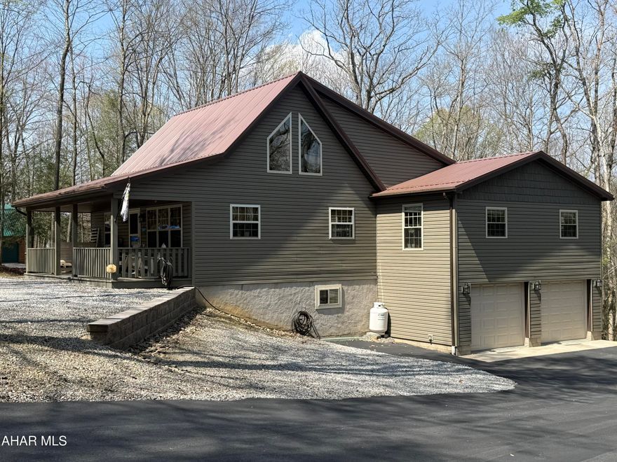 Tucked inside the beautiful, gated Glendale Yearound community, you will find this cozy, well-maintained year-round home. Relax on the front and back porches, or enjoy the openness inside with the two-story vaulted ceiling that fills the home with natural light. Most of the living space is on the first floor, along with two bedrooms, and a versatile den that could also be used as a fourth bedroom or home office. Upstairs there is a loft-style bedroom with a ¾ bath.  The finished basement adds even more living space with a family room. Complete with a 2-car garage and paved driveway, this property is ideal for full-time living or a peaceful getaway.