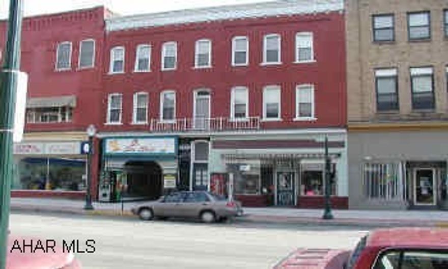 Three story brick building, 2 commercial units on the first floor, garage in rear.  5 apartments. Three story brick building, 2 commercial units on the first floor, garage in rear.  5 apartments.