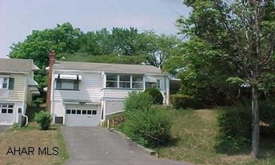 One story , large lot, fireplace, central air, great side patio and small end front porch. Property sold "AS IS"