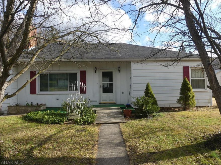 Single-story 2 bedroom home with attached garage on corner lot in Mount Union. Spacious rooms with hardwood floors and living room fireplace. Possible 3rd bedroom and 2nd bath in basement.