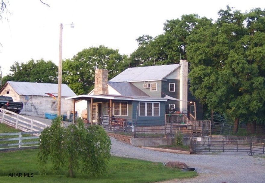 Gorgeous country setting in peaceful valley with beautiful pastoral views and views of State Lands. 71.68 acres currently used as horse farm. Endless possibilities for farming with horses, cattle or other livestock. Property consists of 2 story remodeled farm house, bank barn, stable with 5 stalls, run-in shed, outbuildings and board fenced pastures. Stone fireplace, radiant heat in floors, spa room with hot tub. Natural springs on property and heated systems in pastures. Excellent opportunity!