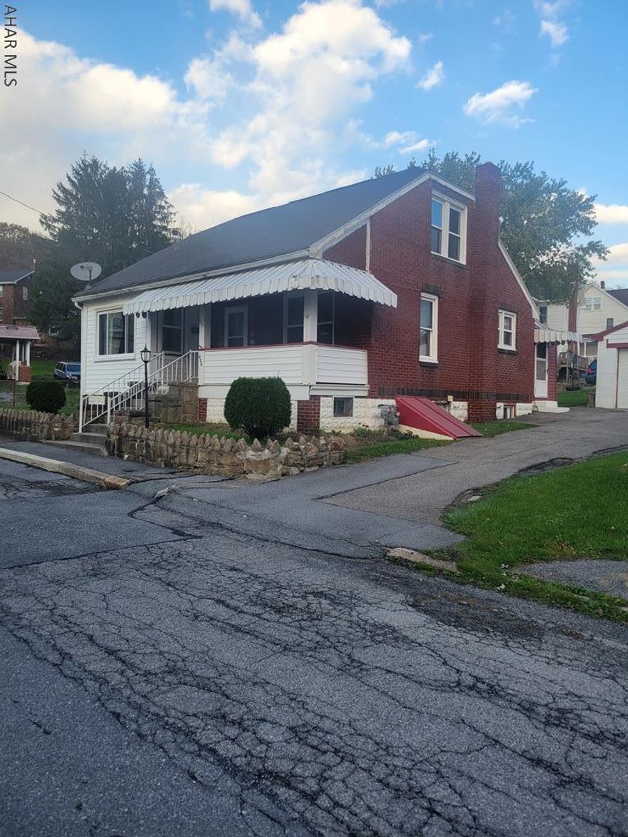 Solid brick home on corner lot with 3-BR, 1-BA. New gas furnace and hot water heater. Large 2 car block garage. Windows and roof have been replaced during ownership. New flooring in living room and hallway. Full basement with lots of room for storage and a 1/2 BA.