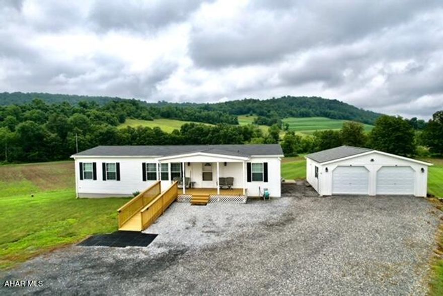 LOOKING FOR A FARMETTE ,HOBBY FARM , NURSERY, ECT... OR JUST PARADISE IN A COUNTRY SETTING .PRROERTY ALSO CAN BE LEASED TO FARMERS. LOOK NO FURTHER THIS 2O PLUS ACRES OF FARM GROUND PLUS SMALL WOODED AREA WITH FULL TIME STREAM COULD BE A WONDERFUL FOREVER HOME BUILT ONLY IN 2019 AND ONLY LIVED IN FOR 2 YEARS IT IS IMACULATE CONDITION . THIS 3 BEDROOM 2 FULL BATHROOMS MANUFACTURED HOME SITS ON FULL FOUNDATION AND IS COMPLETELY HANDICAP ACCESSIBLE .ALSO A DETACHED 2  CAR GARAGE WITH SPACE FOR WORK SHOP. CALL FOR YOU TOUR ?