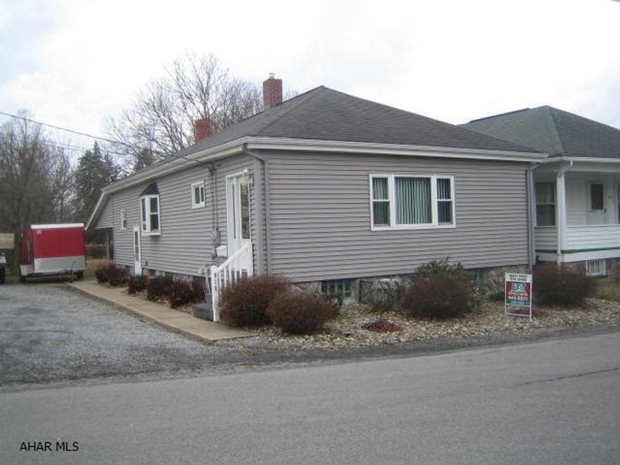 Totally updated Pleasant Valley vinyl rancher features fabulous newer kitchen with corian countertops, formal living room and dining room. Semi-finished basement includes family room with propane heater plus 3/4 bath. Beautiful covered rear concrete patio doubles as a carport in winter months, plus 1 car detached garage. Central air, thermo windows and updated mechanics. Commercially zoned and may be purchased with 2 adjoining properties. See listing agent.