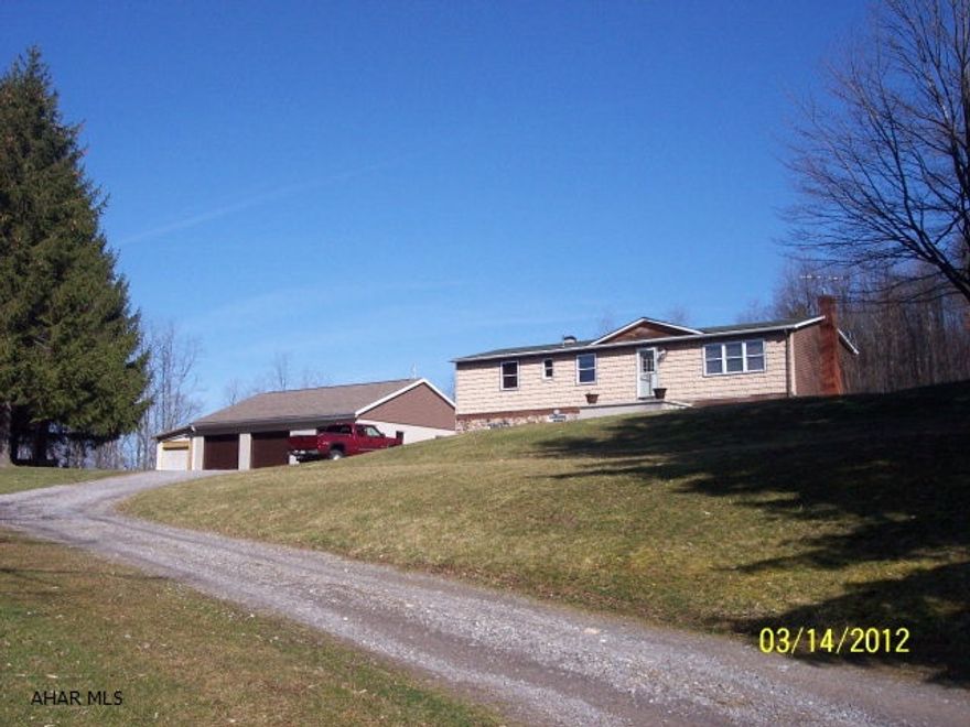 secluded home on 3 acres with many updates.  large 3 car detached garage with new doors and roof
