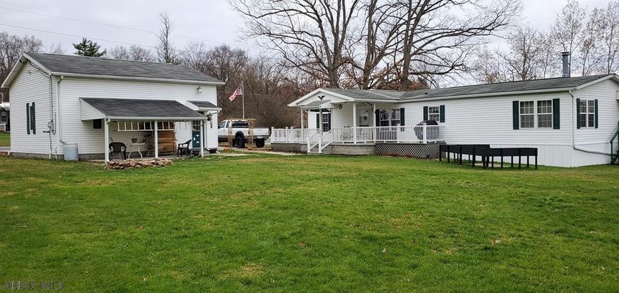 Exceptionally well maintained 3 bedroom,  2 bath 1 story home in Logan Township.  Spacious living room with vaulted ceiling,  family room with stone/gas fireplace and huge kitchen.  Gas forced air heat with central air, public water/sewer.  Oversized 2 car garage,  all on just under 1/2 acre.