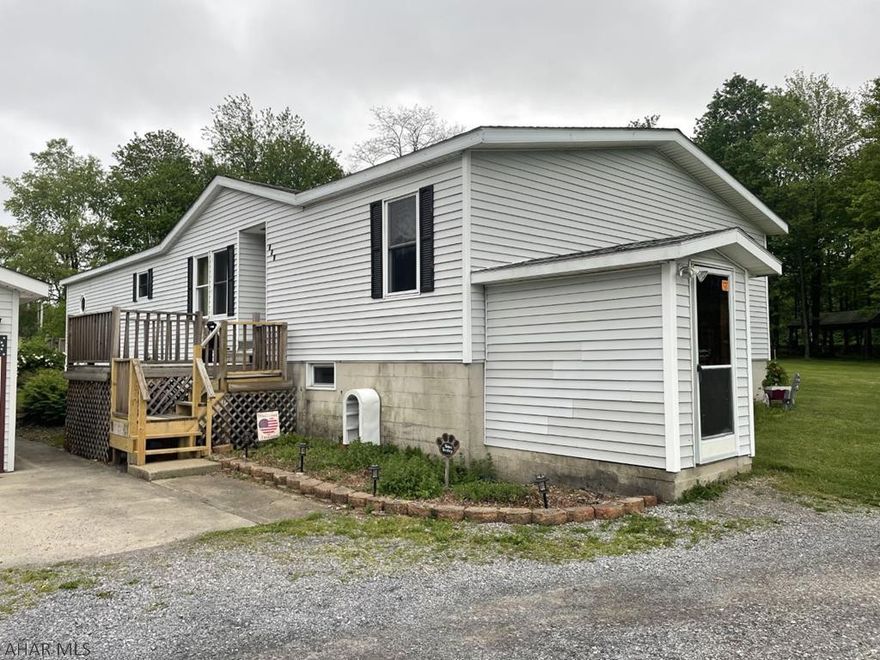 1989 Doublewide on full foundation on almost a level acre lot. Oil, coal, & wood forced air furnace.  2 Car Detached Garage. shed. Roof approximately 10 years old. Natural Gas line outside home to convert heat.  Back-up generator included.