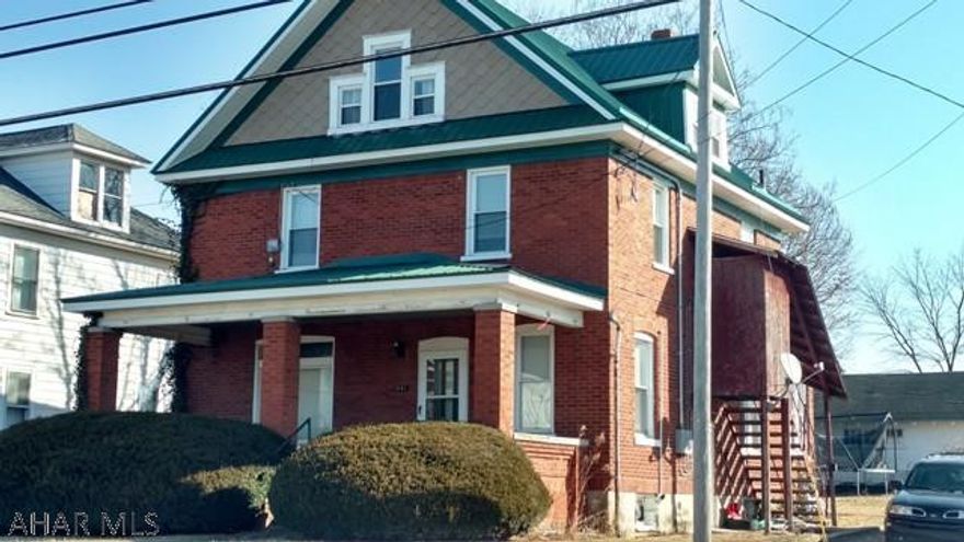 Great Location, Great Price!  Spacious top and bottom duplex, newer metal roof, new windows, detached garage - needs a little cosmetic work, but priced for a quick sale.