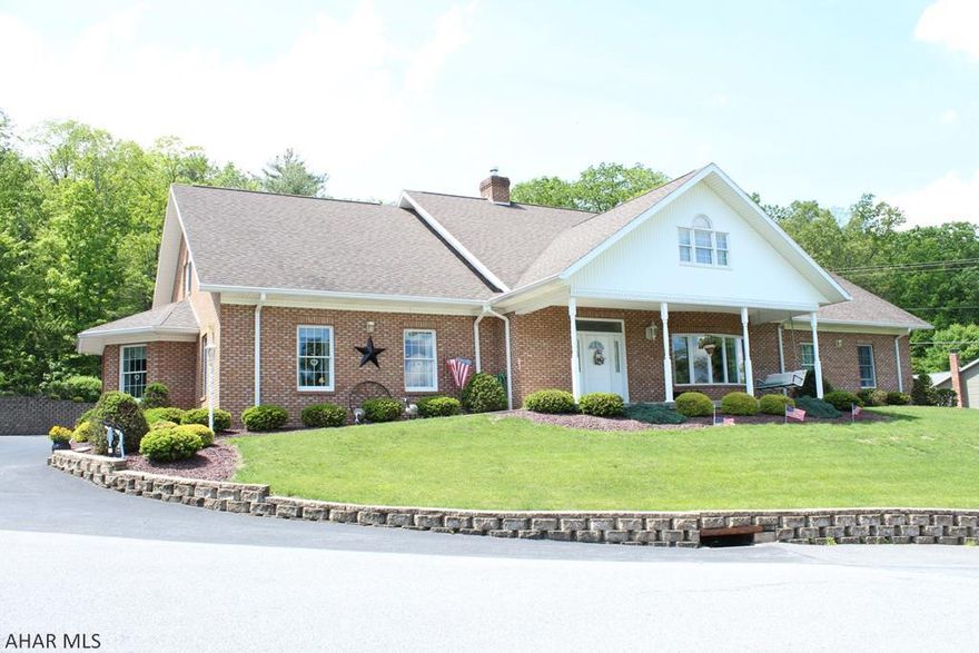 Stunning and spectacular full brick home. Open concept, designer kitchen w/ marble counter tops, center island and built-in desk area. Abundant cupboard space overlooks the family room w/ the brick gas fireplace and breakfast nook. Formal living room, custom window treatments, bay windows. Rear entry room which is light and airy, main level laundry. 10 ft ceilings, extra wide doorways and hallways for handicap access. 2 huge bedrooms w/ walk-in closets. 2 full luxury baths w/ amenities. Take the elevator to the 2nd floor which is fully finished. Geothermal heat in the floors and central air throughout. The 3-bay garage includes a 1/2 bath, heated floor, C/A and is fully bricked inside. Covered front porch, paved driveway and professional landscaping. Walking distance to State Game Lands.