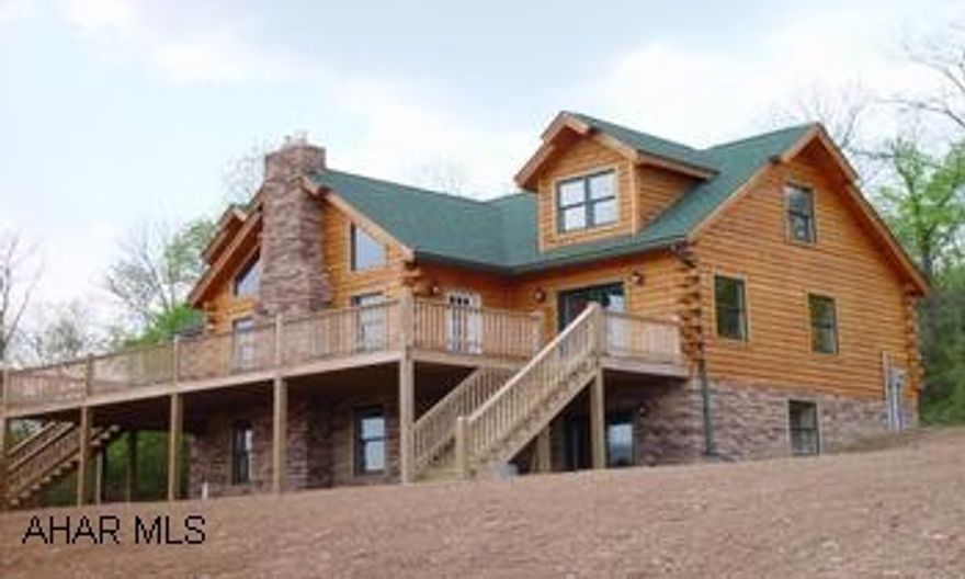 Beautiful,  newly constructed 4BR/3 1/2 BA log home situated on 7+ acres. Beautiful, newly constructed log home on 7+ acres with mountain view. This 3600+ sq. ft. home includes a LR with fireplace and cathedral ceiling, kitchen with hickory cabinets and stainless steel appliances, first level master bedroom. It also includes a finished basement and spacious deck with great mountain view.