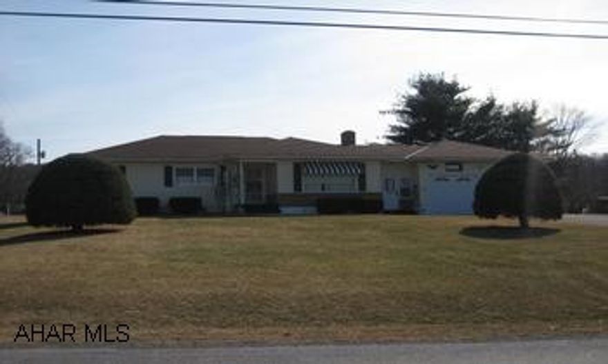 Location! Beautiful vinyl-sided 3 Bedroom ranch home located on a double lot in Pennwood with updated windows, AC, fireplace, and much more.  Only $175,000!  Call Lacy today!! Location, Location, Location!!!  Beautiful, newly vinyl sided ranch home located on a spacious level double lot in the Pennwood Development in the Bedford School District.  This 3 bedroom home boasts a stone fireplace, hardwood floors, thermopaine windows, paved driveway, central air, and much much more.  The basement features a spacious hobby area and canning room.  Minutes to the many woders our beautiful area of Bedford has to offer.  You could sell the extra lot and maintain the home for a great investment of only $175,000!!!  Call Lacy @ 724-494-1086