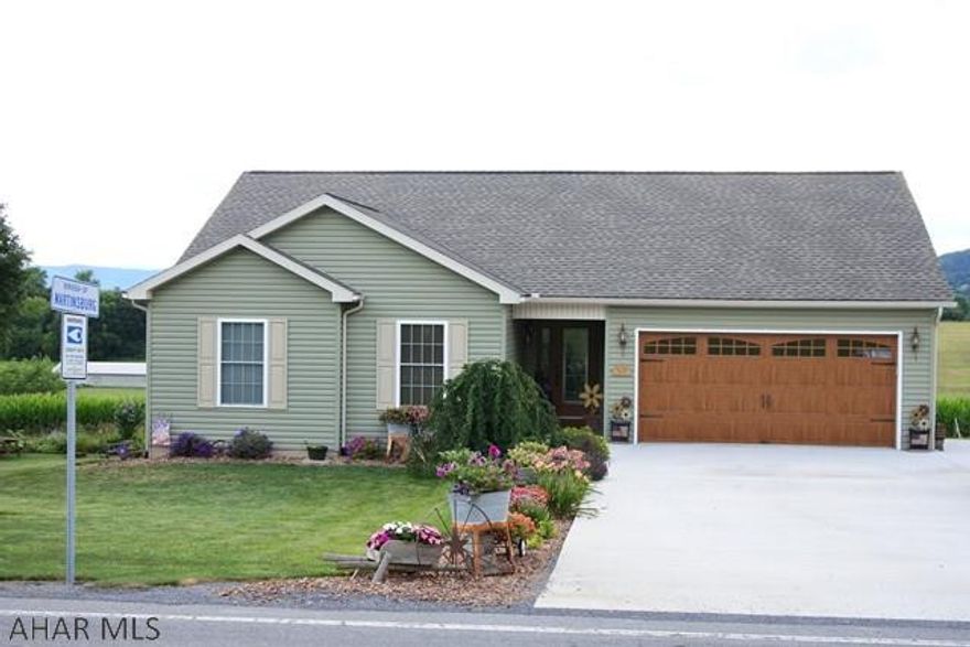 Better than new!  Extremely well maintained  Ranch home.  Easy living on one floor, including the laundry.  3 bedrooms, 2 full baths, spacious LR and a HUGE family room in the lower level...double glass doors lead out to a concrete patio.  Enjoy the sunsets from the deck....they are gorgeous.  Country living...but only steps to town...public water and sewer.  Owners continue to improve the property...all new exterior doors and carriage house garage door.  Plenty of perennials, too.  Lots of storage inside plus a 20x20 shed.  Cute, cute, cute....and all kitchen appliances stay. Showings Mon-Fri need to be after 4:30.