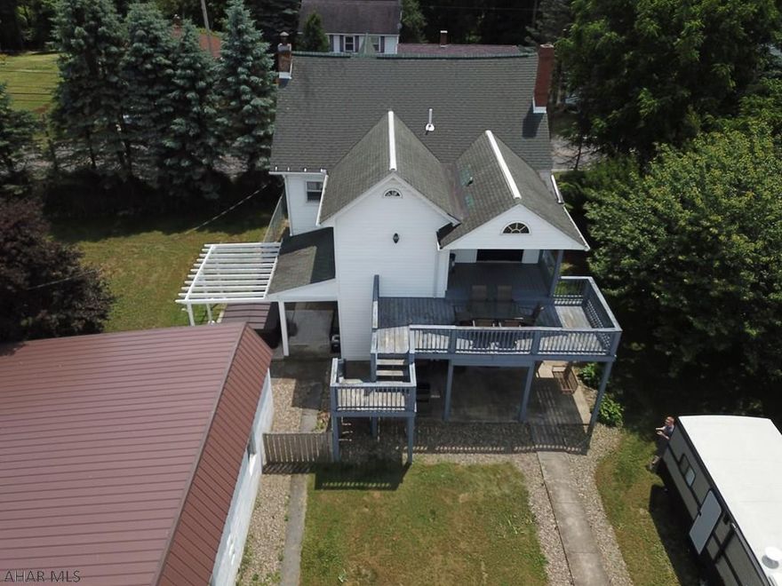 A rare find in desirable Bellwood school district! This home features open floor plan, 4 large bedrooms, plenty of closet space & 2 zone heat and A/C. There's a newly finished walk up attic w/ shiplap walls. The master suite has a walk-through closet. The kitchen is the perfect spot for entertaining w/ a two tier island, quartz countertops, eat in & large pantry! Ceramic tile throughout! The first floor laundry room is huge. The private backyard is fully fenced in w/ low maintenance landscaping! Outdoor spaces include a brand new front porch, large deck, & 2 patio areas as well as a fire pit, hot tub & 2 vegetable gardens. The 2 bay garage has room for 4 vehicles w/ newer metal roof. Sellers have completed many upgrades! Call for your showing today. Seller is licensed PA real estate agent.