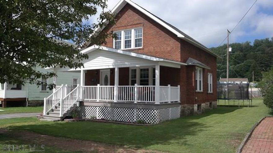 Beautiful brick 1 and 3/4 story home completely remodeled down to the studs including new roof, windows and wiring.  Extra large covered front porch and large wooden deck off the back of the home.  Bathrooms, foyer, and kitchen have ceramic tile floors and carpet in rest of home is brand new.