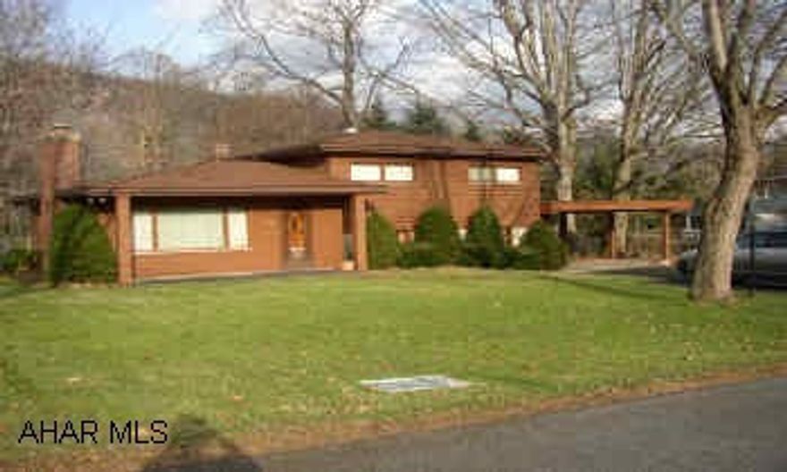 WELL CONSTRUCTED.   PLASTER WALLS, HARDWOOD FLOORS UNDER CARPETING IN HALL AND BEDROOMS.  PARQUET IN LIVING ROOM. NEWER FURNACE, HOT WATER TANK, WELL PUMP AND MOTOR.  INDUSTRIAL RUBBER ROOF ON CARPORT AND GARAGE (2001).