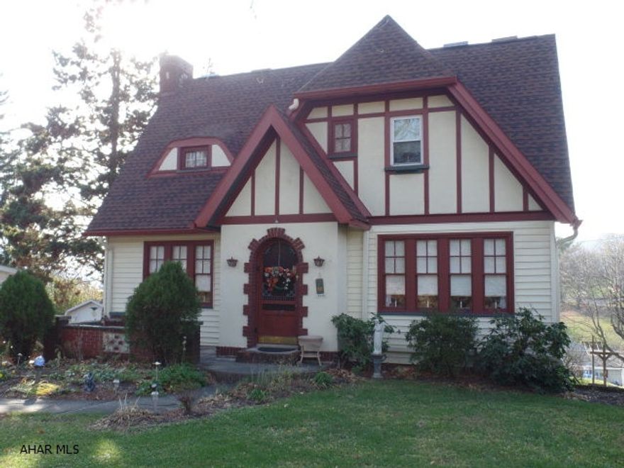 Reminiscent o an English cottage this home has so much character. Foyer with barrel ceiling opens into an entry hall with outstanding staircase. Hardwood floors, built-ins and mountain views through out. First floor boasts full bath w/Jacuzzi tub. 2nd level has 3 bedrooms with HW floors and cozy den/office, bonus room situated off the landing would make a perfect crafting/reading room. Partially lower level has exposed stone walls and would be the Man Cave or Family Room. This home has been well maintained and updated and is move in ready.