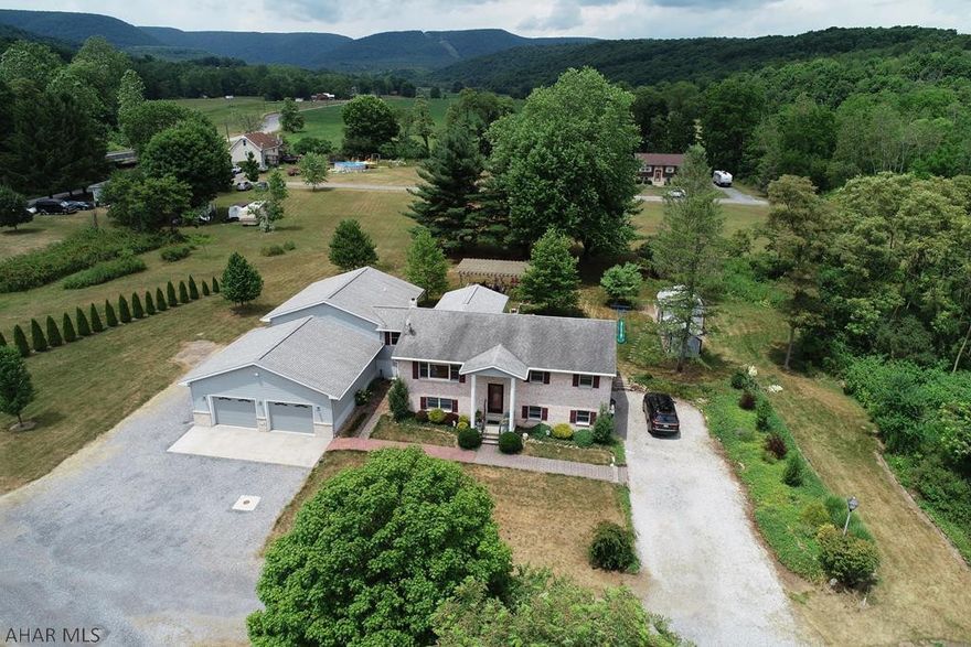 Extraordinary home that must be seen to be appreciated.  Located in a lovely setting with walking trails on 2.54+/- acres.  Exceed one's expectation with the home's stunning upgrades which include a wheel chair accessible master suite with elevator and cathedral ceilings.  Enjoy cooking in a chef style kitchen with quartz counter tops adjoining a huge dining room overlooking a custom built covered porch.  New 6 zoned furnace coupled with upgraded insulation throughout ensure maximum energy efficiency.  Radon mitigation, central air conditioning, whole house fan, 3 level elevator, built in tree scuptures, pergola, upgraded electrical, 30'x 28” garage w/ 10' doors, Vector security system, custom blinds & solid surface bathrooms and kitchens and tons of storage in the lower and upper levels.