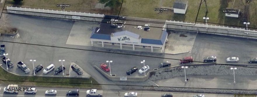 Former/Current Automobile Dealership on 1.4 Acres. The building is located on a corner lot in a high traffic area. The building has 3200 SQ. FT.and 18 FT. Ceilings. Close to local eating and Shopping.