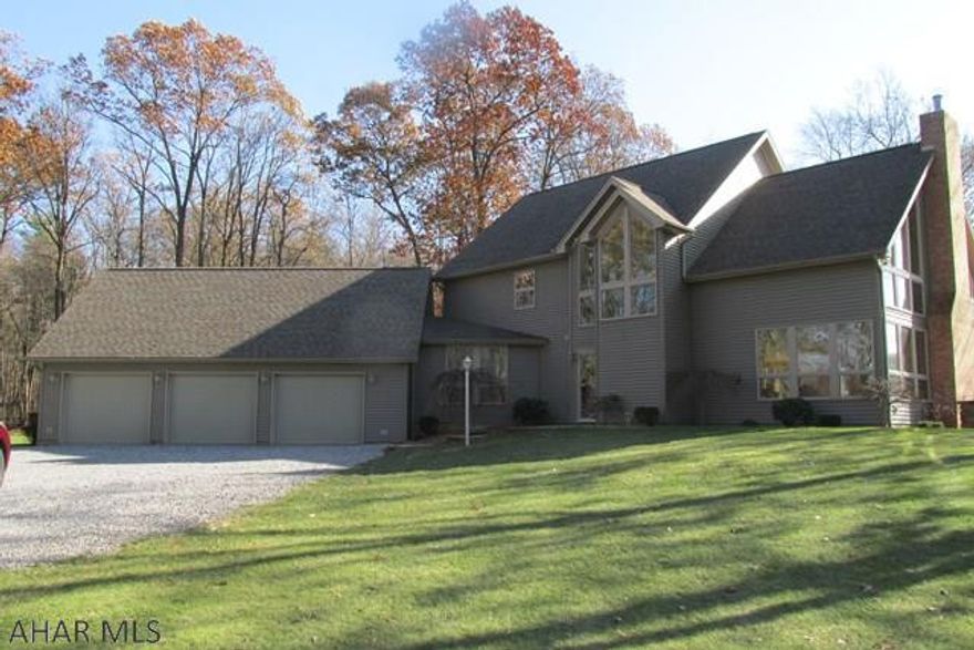 Enjoy the peaceful private setting for this gorgeous 2 story. Open concept floor plan, 3 bedrooms, 2.5 baths, (2590 sq ft). Great room with gas fireplace, great view, wooded lot, attached 3 stall garage and 1 car detached garage, custom paver patio, on 2.59 acres.  Geo thermal radiant heat in the floors 10 zones - 3 zone central air. Too many amenities to list, please see attached documents. Quality workmanship, materials and fixtures.