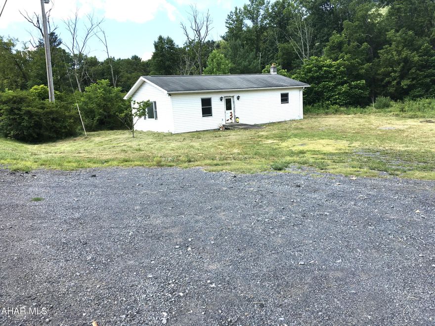This highly visible 1.66 acre property located along Raystown Rd. Everett , Pa. could have so many uses. Think retail, hair/nail salon, coffee shop, previous use was a flower/gift shop. Has a stick built building with 1008 sq. ft. complete with well water, public sewer, electric , oil f/a heat, 1/2 bath. Plenty of outside area for parking. Has space outside  for storage units. Could also be a single family building spot if desired.
Not to far from Raystown Lake for camper or boat storage or repairs.
Use you imagination on this one and do not miss it.
