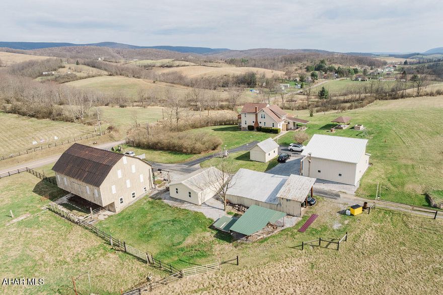 Remarkable Working Farm, with many coveted agricultural amenities in this Truly Peaceful and Quiet setting in Bedford County, PA.  Lovingly maintained and improved for over 40 years by only the second owners.  Beautifully preserved 2 story Barn, with heated bowl, 7 additional buildings to include garages, 2 story Pole Building with apartment, (buildings have heat and water sources, and bathrooms), 5 springs/streams, 1 artesian spring, 1 large and 1 small pond, 3 drilled wells, 10 frost free faucets on property, A Generator by PTO Hookup runs the entire farm if necessary. High Tension electrified fence and electrified custom security gate, multiple gas and diesel tanks, Additionally, the owners have lovingly maintained the character of the home while providing thoughtful and solid updates..to include a dining room addition with heated floor and walls of windows with amazing views, original pantry, new Cafe appliances, generous supply of wall outlets, all doors and windows less than 10 years old, a french drain around the entire home, 2 heating systems, (4 zones), central air, new carpeting in the second floor bedrooms, heated floors in basement, additional w/d hookup in mudroom, updated wiring and plumbing, Security lighting throughout the farm...and much more-- only 7 miles from the Sheetz Distribution and Corporate Campus.