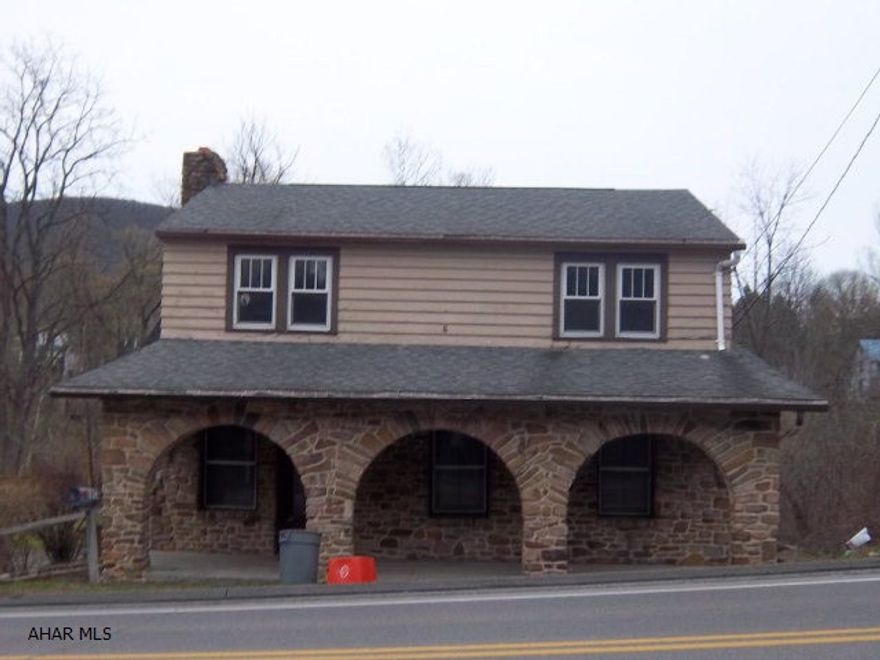 PRICE REDUCED!!!!!Rustic charm meets modern convenience!!!  Stone home with beautiful view of flowing creek out back. Original hardwood floors, trim and historic handmade stone fireplace in living room!  Spacious bedrooms and plenty of attic storage. Updated bathrooms and kitchen appliances. Close to everything yet nestled enough to sit by the flowing creek and relax at the end of your day. Call today to make an offer!