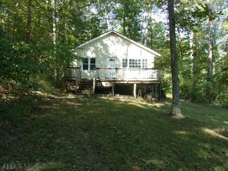 Over the creek and into the woods to your private retreat on 10.5 acres!!!  Private bridge crosses over Doe Lick Run to a 24x24 cabin nestled at the edge of the woods. Good hunting.  Nature lovers - bring your camera.  Enjoy the quiet.
