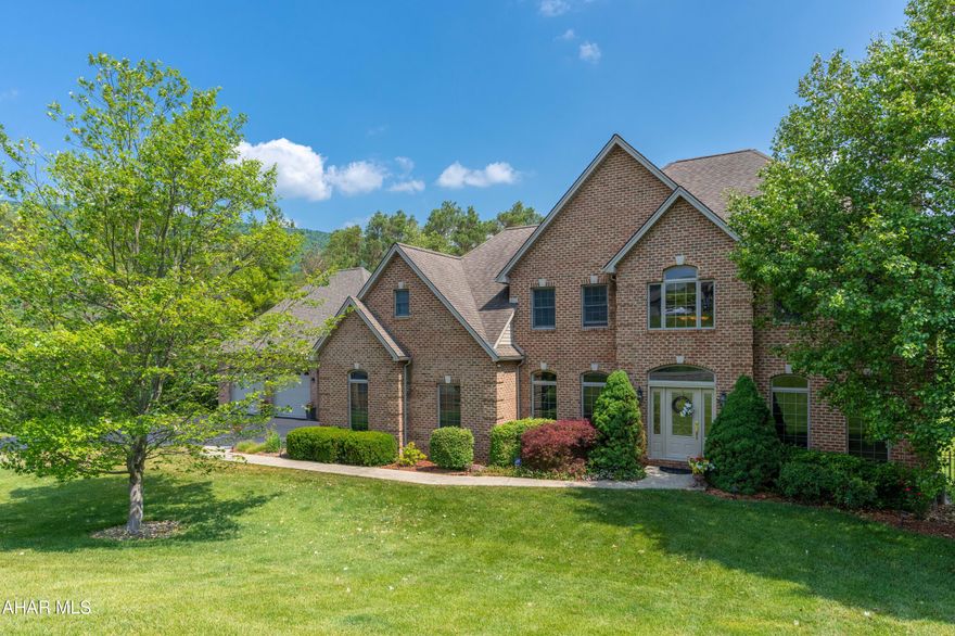 Magnificent 4BR, 4.5BA in highly sought after Clearview Estates, Hollidaysburg.  Entering through the front door you are immediately welcomed by a spacious foyer that will impress with an abundance of natural light from the 2 story high ceiling.  Topped by a winch controlled chandelier, the space has an open balcony for the large second floor landing. A formal LR with carpet has crown moulding and floor to ceiling windows.  A formal dining room boasts beautiful hardwood floor and crown moulding that tops floor to ceiling windows.  The convenient first floor laundry area is a great work space with a tub and cabinetry.  The kitchen is grand and is an open, eat-in floor plan with family room.  The custom maple cabinetry and island are trimmed in granite and stainless steel appliances atop a new slate floor.  Enjoy the extensive storage with the pantry! The valley views are expansive from many areas of the home including the large deck just off the kitchen and pave stone patio off of the lower level family room.  Three oversized bedrooms, each with their own bathrooms are on the second floor along with a Master Suite fit for royalty! The stunning cherry hardwood floors in the master bedroom continue into the master bath that has a large, custom, walk-in shower, tub, double sink cabinetry with vanity area, water closet, linen closet and walk in closet. Entertain with a huge lower level family room featuring recessed lighting, a wood fireplace, 3/4 bath, and walks out to the fenced yard.  Don't miss the 6th garage space that is currently being used to store lawn care equipment.  This home offers bountiful living space and storage.  Don't miss the opportunity to own this fantastic home in a great location with the most amazing views!