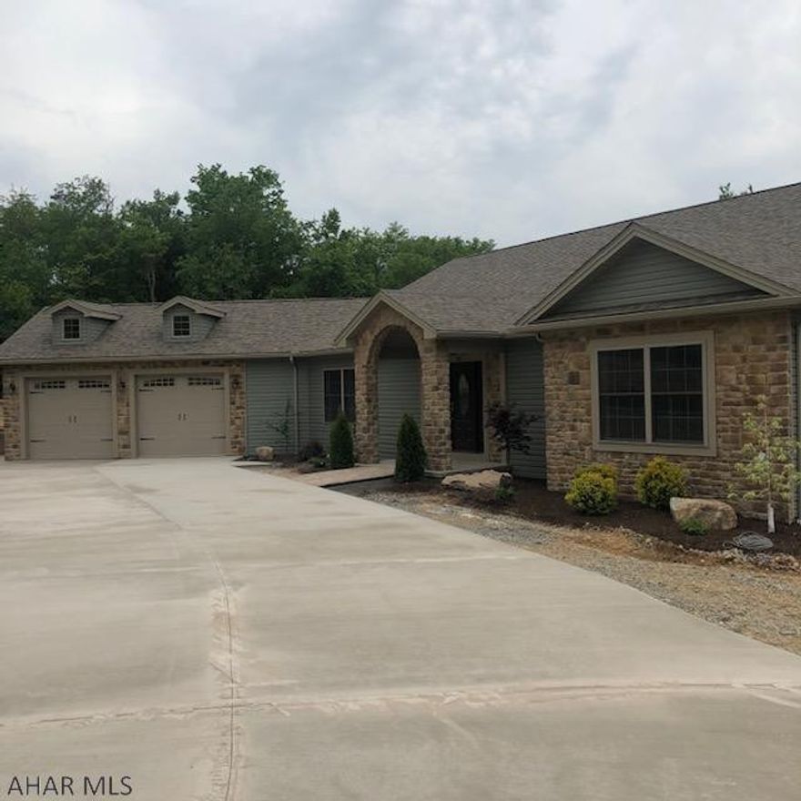 Terrific price on this newly constructed home in Church Hill Manor Development. Pulling in to the extended concrete driveway you'll see lovely landscaping, nice outdoor lighting & a unique stone arched entrance.  Enjoy a spacious foyer with wood floors extending to the large living room with whitewashed cathedral ceiling, stone fireplace & access to a cozy covered porch that offers privacy but also has views. The kitchen area is open with loads of cabinet & granite countertop space, built-in desk area & nearby separate dining room for formal entertaining. A separate area with bedroom, 3/4 bath & laundry offer privacy for guests. Another bedroom, full bath & large master bedroom, w/huge walk-in closet & en-suite bathroom. Large basement w/private covered patio offers more options for you.