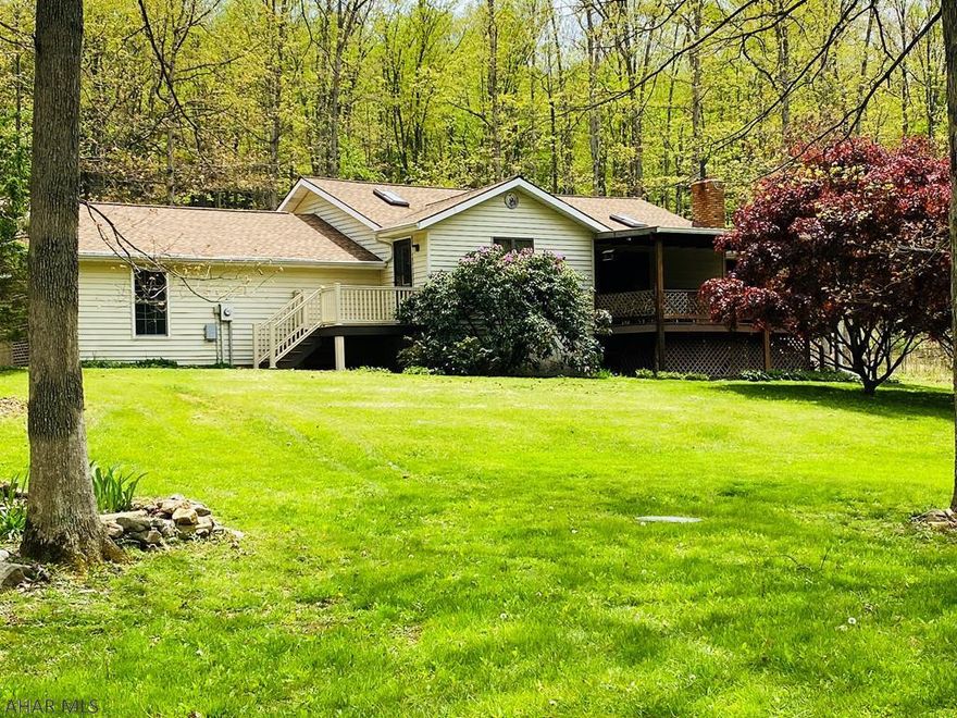 Nature lovers will love the seclusion of this 6.04 acre gem located within minutes of the Omni Bedford Springs Resort.  Upon entry one will immediately be drawn to the two story grand great room kitchen area that opens onto a huge covered deck and sunroom.  Wood and stone give a warm and cozy feeling throughout that make the home so inviting.  Lovely details give this home character and charm that evokes a feeling of warmth and solitude.