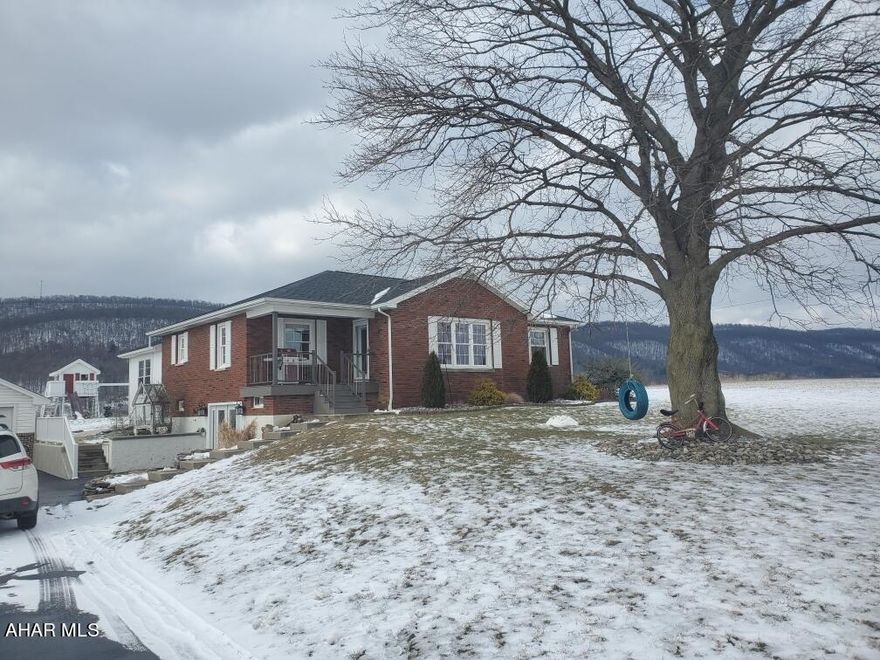 Beautiful Views await you in this raised ranch with hardwood floors and a beautiful custom kitchen. Home has 3 bedrooms and bath on the main floor, with a tastefully done addition off the back with laundry area. Lower level is walk-out with lots of finished space including a bedroom, bathroom and family room.  Whole home is well renovated and in great condition. This home is beautiful and well maintained. Large 2+ car garage and shed out back. The views on this lot are 360! Wont last long!