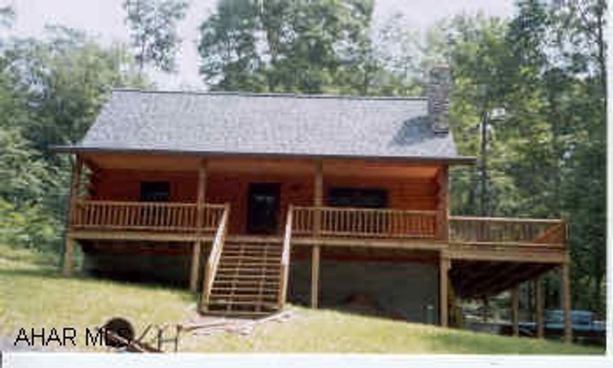 Log Home on 20 acres Very nice private setting pond.....