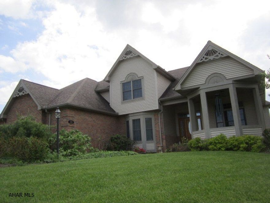 Beautiful custom home with fantastic view. The home features new hardwood floors & oak trim, renovated kitchen with granite counters and stainless steel appliances. A first floor master bedroom with recessed ceiling and master bath. The home has a new 14KW hardwired self starting generator.