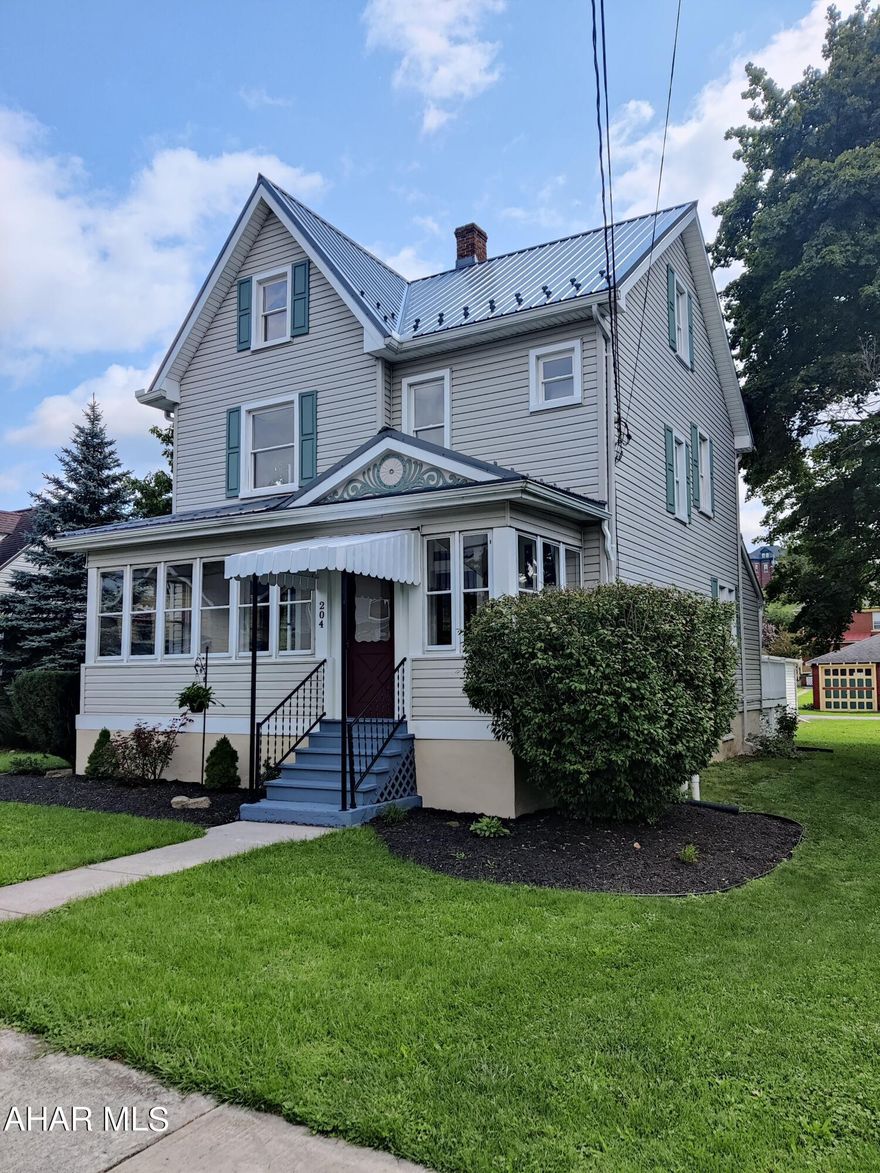 Remodeled 3 BR, 1.5 Bath with Deck and Garage. Freshly Painted Throughout, New Metal Roof, Hardwood Floors in LR, DR, and Foyer. 1 Car Garage with Carport. 2 Enclosed Porches. Large Attic could be Finished for Additional Living Space. Half Bath is in the Basement. Just Move In!