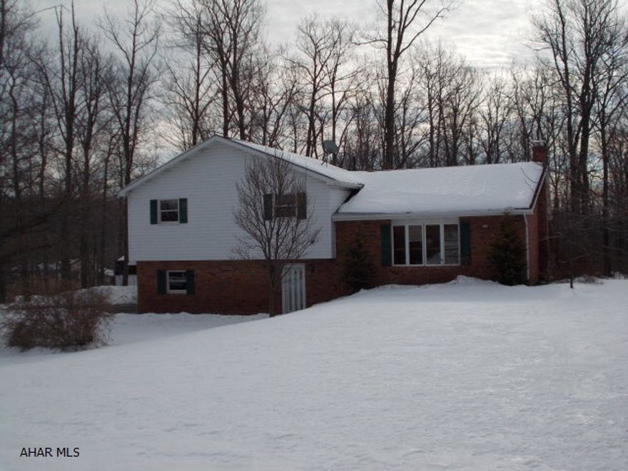 Very nice Multi-Level home on 0.982 acre lot abutting the State Game Lands. Laminate floors throughout main living area. Large living room, dining area opening to rear deck. Oak cabinetry in kitchen, new range, dishwasher and sink. Large Master Bedroom with private bath. Open floor plan, finished Family Room with wet bar, stone wall and hearth-ready for pellet stove or fireplace. 2 cr garage and great yard for entertaining! Entire home painted in January 2013.