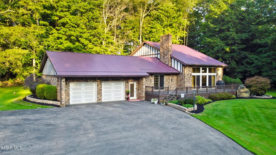 Welcome to your dream oasis of comfort & convenience, located at 116 Logan Lane in the highly sought-after Central Cambria School District. This stunning multi-level home is beautifully nestled on a tranquil 7.3-acre lot, showcasing meticulous attention to detail throughout. As you step into the main floor, you'll be welcomed by a spacious tiled foyer that opens to an expansive living room featuring soaring cathedral ceilings, plush new carpeting, & a cozy propane fireplace. The kitchen has been tastefully updated w/ brand-new appliances, luxurious vinyl flooring, & custom granite countertops. The main floor also boasts three generously sized bedrooms, two full bathrooms, a convenient laundry room, a dining area ideal for entertaining, & a versatile bonus space that invites relaxation & gatherings. Venture upstairs to discover an office, an additional bedroom, & the master suite, which offers a lavish en-suite bathroom & an impressive walk-in closet designed for all your storage needs. The unfinished basement has been thoughtfully framed & is ready for your finishing touches. Additional highlights of this remarkable home include a newer furnace & hot water tank. Finally, you'll find an attached two-car heated garage w/ overhead storage, a spacious detached garage measuring 25x35 w/ electric, & ample space for a potential pond w/ a dock. Enjoy the beauty of nature w/ walking paths, lush blackberry bushes, & a large entertaining deck—all while basking in the privacy that this property provides. Don't miss the opportunity to make this exquisite haven your own! Call today for more information and to schedule a private tour!