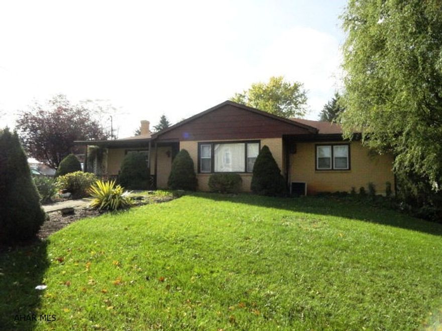 Three BR Brick Ranch, edge of town. .72 acres 1 car attached garage. Nice kitchen with center island. Large rooms. Sun Room.