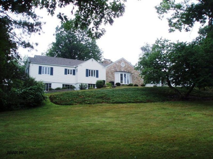 One of a kind Stately stone/vinyl ranch on 8 ac. in Orchard Heights!  Great floor plan with hardwood floors, crown molding & hardwood doors throughout.  A bay window in DR & LR. 4 beautiful fireplaces. A bathroom for each BR.  Large rec. room in basement with wet bar & brick FP. Beautiful lot with mature trees scattering the 8 ac.  So close to town, yet a great lot to add on. 4th BR & bath is upstairs... great for a kids space.