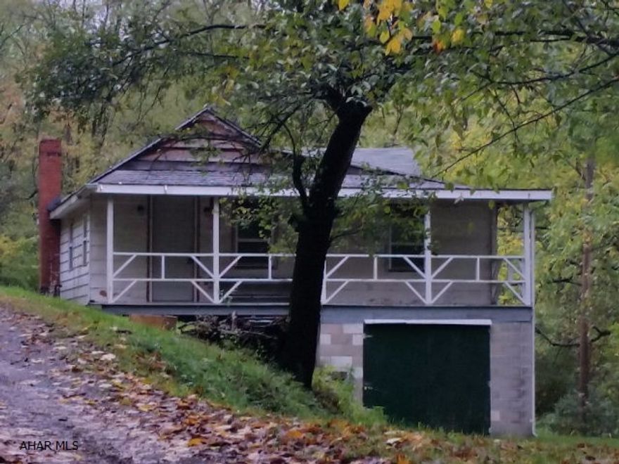 Great Hunting Camp Getaway. Fully furnished 2 bedroom, 1 bath cabin with eat-in kitchen, living room and 1 car integral garage. Covered front porch with great view. Some breakers and some fuses. SOLD AS IS.  J-361