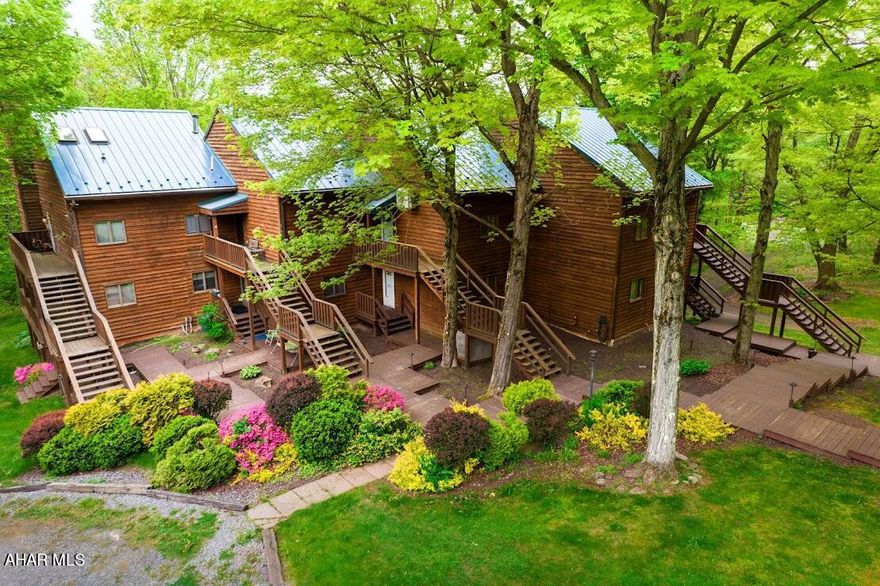 Nestled in the serene woods of the Blue Knob mountains, these charming condos offer a perfect retreat just 10 minutes from the Blue Knob Ski Resort. Enjoy the convenience of being only 15 minutes away from the Blue Knob Clubhouse Bar and Grill for delicious dining and socializing. The location also provides easy access to three vibrant cities—Altoona, Johnstown, and Historic Downtown Bedford—each just 25 minutes away, where you can explore a variety of shopping options, fine dining establishments, and unique shops.  You can find fishing, hunting & ATV activities at Blue Knob. Whether you're seeking adventure on the slopes or a peaceful getaway, these condos provide the ideal mountain escape.  This condo is priced to sell!