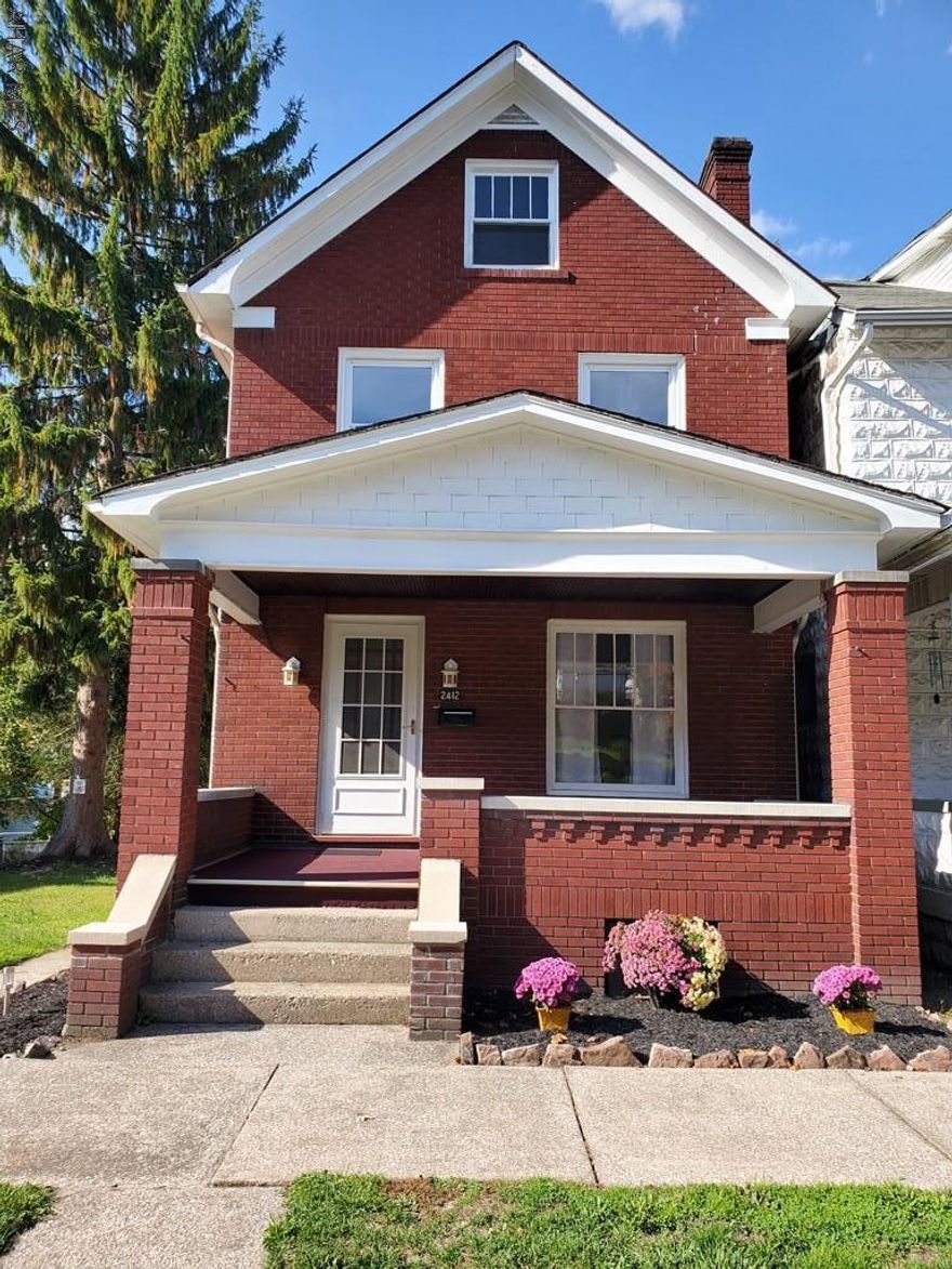 Beautifully updated Brick home on Double lot.This home boasts a brand new kitchen with stainless steel appliances that opens up into the dining room. For added convenience a brand new 1/2 bath was added to the first floor. The first and second floor have new carpert and all rooms have been freshly painted!!  There are Hardwood floors hidden under carpet. There is so much charm with the beautiful original woodwork and Pocket doors.  Rooms are large and contain nice size closets. Newer Roof and Furnace. Brand new 100 AMP electrical service. Two bedrooms on 2nd floor and two bedrooms on third floor.