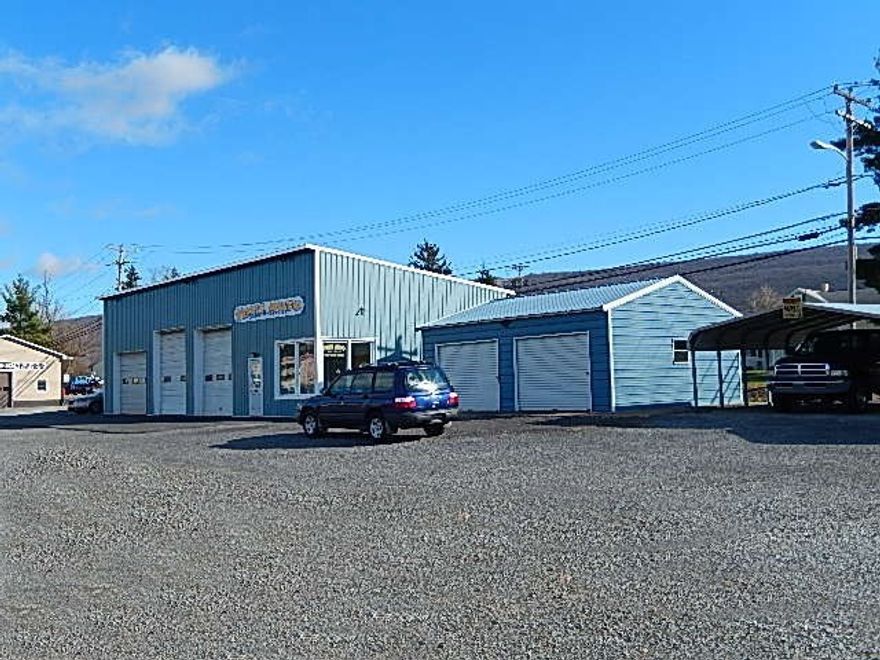 Location! Location! 3 bay commercial garage. 24X41 pole building w/public sewer, additional 200 amp service. 2 car 26X22 metal garage (w/electricity, no sewer/water), 444 ft of frontage on Rte 220.