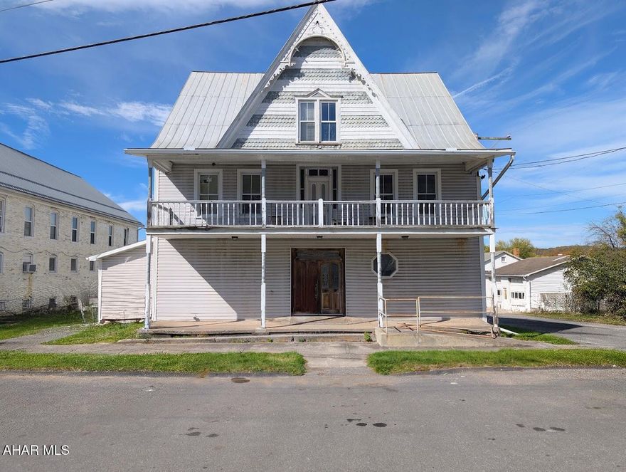 Exceptional value-add commercial property offering over 12,000 square feet along highly traveled State Route 31 with strong visibility and traffic exposure. Located minutes from Shawnee State Park, Bedford, and the Maryland line -- a corridor benefiting from tourism and regional commerce.

The building has been taken down to the studs, creating a true redevelopment-ready opportunity. One newly completed two-bedroom, one-bath apartment is already finished and rented at $1,250 per month, providing immediate income.

Based on the current owner's layout plans, the structure could accommodate a total of 13 residential units:
• 9 two-bedroom apartments
• 4 one-bedroom apartments

With one unit already complete, there is potential to add 12 additional income-producing units, offering substantial long-term rental upside.

That said, the flexibility of this building allows for far more than residential use. The scale, layout, and prime Route 31 exposure support a variety of possibilities including:

• Multi-unit apartments
• Mixed-use retail with upper-level residential
• Boutique hotel or short-term rental concept
• Brewery, restaurant, or bar
• Office or professional suites
• Retail storefront or outfitter business

Large rear parking lot plus front street parking enhance accessibility for tenants, customers, or guests -- a significant advantage for commercial or mixed-use redevelopment.

For investors and developers, this property offers:
• Existing rental income
• Redevelopment-ready condition (taken to studs)
• Strong multi-unit potential
• High-visibility location
• Flexible commercial possibilities

Complete the build-out as residential, pursue a mixed-use vision, or reimagine the space entirely -- the opportunity here is scale, location, and upside.