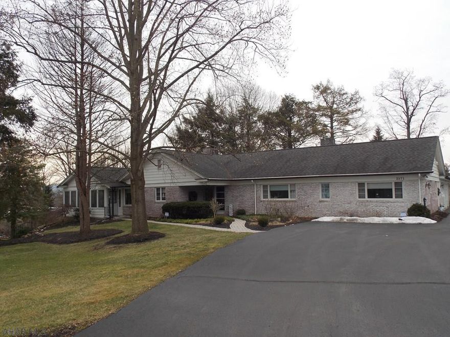 Beautiful ranch home in a very desirable location in Hollidaysburg.  Nothing left to do in this home because it has already been done.  Gorgeous new kitchen and 3 and a half new baths.  All but the half bath have radiant heat floors.  The Great Room/DR combination has a wood burning FP and tons of windows that give so much light. The sunroom is heated and adds extra space for entertaining because it leads to the new deck with beautiful views.  There is a 3 car garage and the driveway has both an entrance and exit and will hold many cars when you have visitors.  If you are a golfer walk right over to the Blairmont for golf a swim or dinner.  This home is on a crawl space and does have storage in the attic with pull down stairs.  So much to offer and a .93 ac. lot.  Give us a call today!