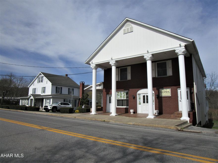 -EXCELLENT INCOME OPPORTUNITY:  
Funeral home w/ 4 apt's. on 2nd & 3rd flrs. + basement garages + nice, 2-sty. single-family house + 0.602+-acre site with abundant on-site, paved parking for 34+-cars. Public water & public sewer. ''CONVERT MAIN LEVEL OF FUNERAL HOME INTO ADDITIONAL APARTMENTS! 

INCLUDES:
2.5-Story, 1900-built, funeral home with 4 nice apartments + basement garages with a 5+-vehicle capacity. 

AND, 

Single-family house - 2.5 story era 1885+- with additions, 3 BR, 1.5 baths, quality-finish kitchen with built-ins, formal rms., fam, rm., fireplace, porch, deck,,... ;

And, 

-0.602+-Acre Site:  Spacious, paved parking lot with 2 paved driveway accesses; capacity for 30+ cars. Public alley access  along east side of funeral home as access to basement garages (2 overhead doors).

-There may be 3+-wells on the property;  statuses are unknown, e.g., if still there, locations, depths,....

-Sq. feet of building areas; site areas; taxes; borough & township ordinances/etc.; &, how utilities are split/set up' are  to be confirmed by Buyer; NO warranties are implied by the participating real estate agents & their realty offices.