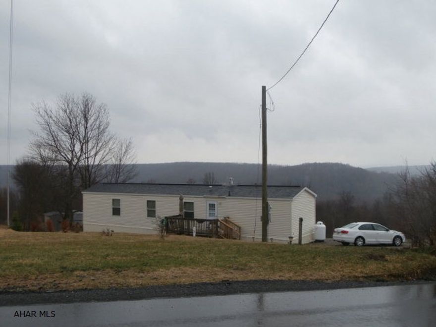 As New single wide mobile home used as a vacation home. Piers installed to code. Over 4 acres of land with great view. A few miles from Prince Gallitzin State Park and Rock Run Recreation area.