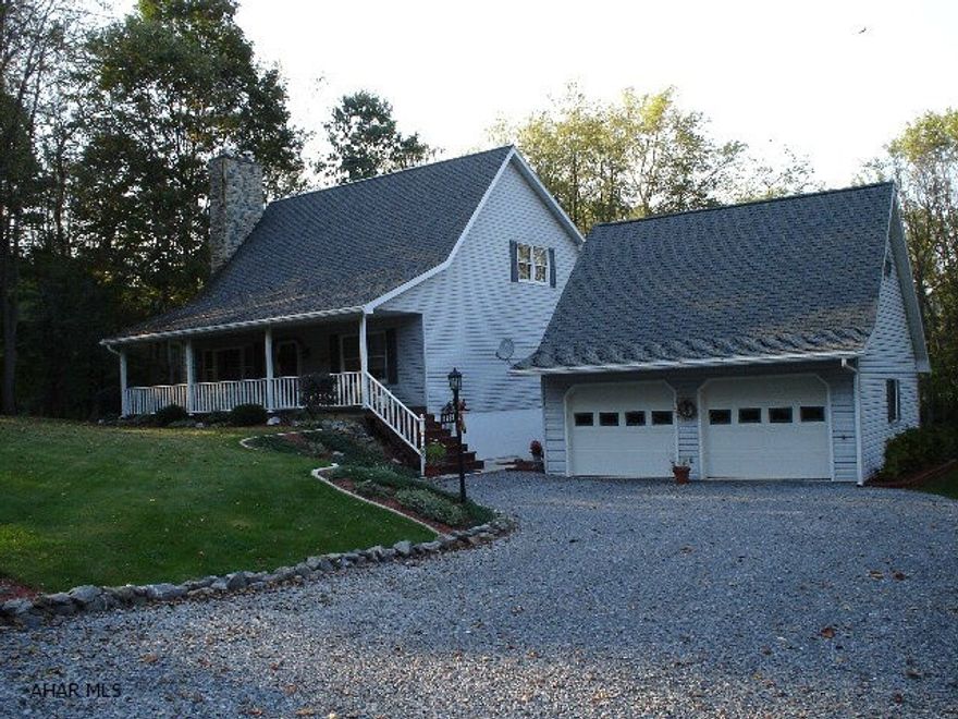 This pristine 1.5 story property is on 2 private wooded acres just minutes from Lake Raystown.  The home has a formal living room, eat-in kitchen, three bedrooms, two full baths, and one 3/4 bath.  The loft, where the master bedroom and a full bath are located, overlooks the main floor.  The property comes with the refrigerator, range, microwave, dishwasher, washer, dryer, and all window coverings.  Fully furnished basement.  2-stall detached garage.  Front and rear covered porches.  The property has a large deck off of the back porch.  The property is very clean and in move-in condition.  It was also recently painted.
