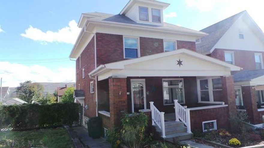 Nice brick home with hardwood floors, original woodwork, finished and heated 3rd floor for 4th bedroom, double lot.