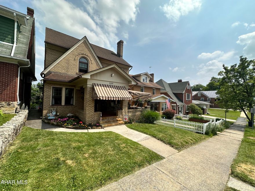 Stately brick with 4 bedrooms, 1 full bath,  2 - 1/2 baths, and 2nd floor laundry. Original hardwood floors add character and charm to this well maintained home. Main floor offers a family room off the formal dinning room with arched French doors. New kitchen flooring was just added. The finished 3rd floor makes the 4th bedroom with hardwood floors. There is also a 2 car integral garage. Relax on the covered front porch with new awnings.