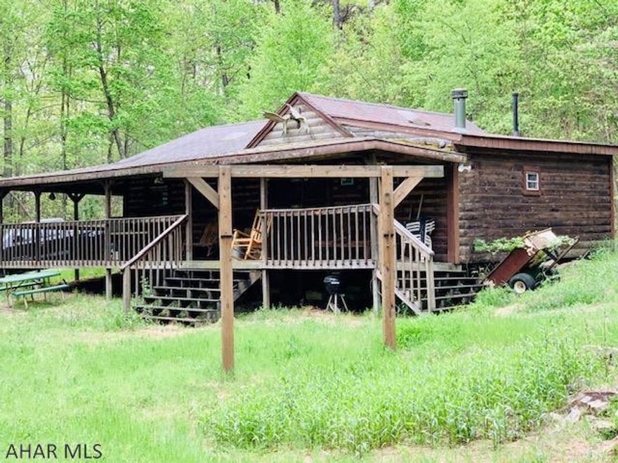 RECREATIONAL/HUNTING PARADISE with 2 CABINS!!  Lots 5 & 6, Spacious 2 bedroom Log cabin with wrap around porch and a separate cabin for the guest!   Gated and Private. Internet and land line phone service.  3 ponds, Gas and Mineral Rights convey, Pine Grove Association, 6 tree stands for hunting. The main cabin features pine wood walls, cathedral ceiling with skylights, a wood burner stove, a kitchen with cabinets, furnished and sleeps 6 or more . The bedroom offers pine wood wall and ceiling and a loft for sleeping. The 2nd bedroom has a wood burner and pine wood walls and ceiling and adjacent to the bath room. The guest cabin is also pine walls and cathedral ceiling, with skylights, wood burner and furnished.  Storage trailer for the ATVS!  AS IS WHERE IS! HOA $100 yearly,no snow removal